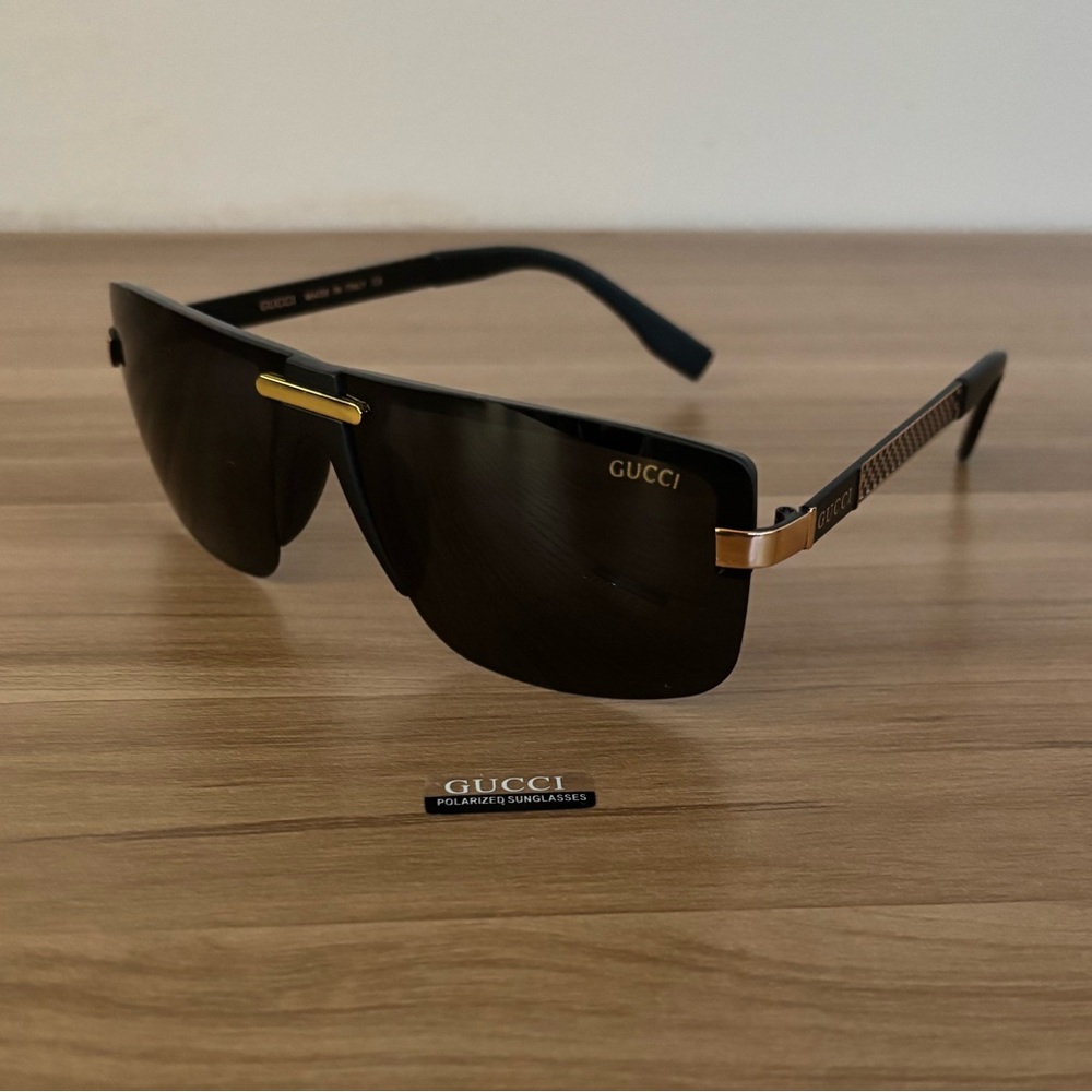 Gucci Black Sunglasses with Gold Detailing